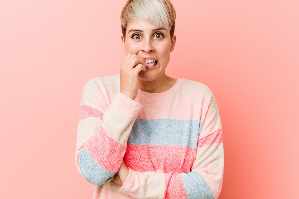 young-natural-curvy-woman-biting-fingernails-nervous-very-anxious_1187-27896.jpg
